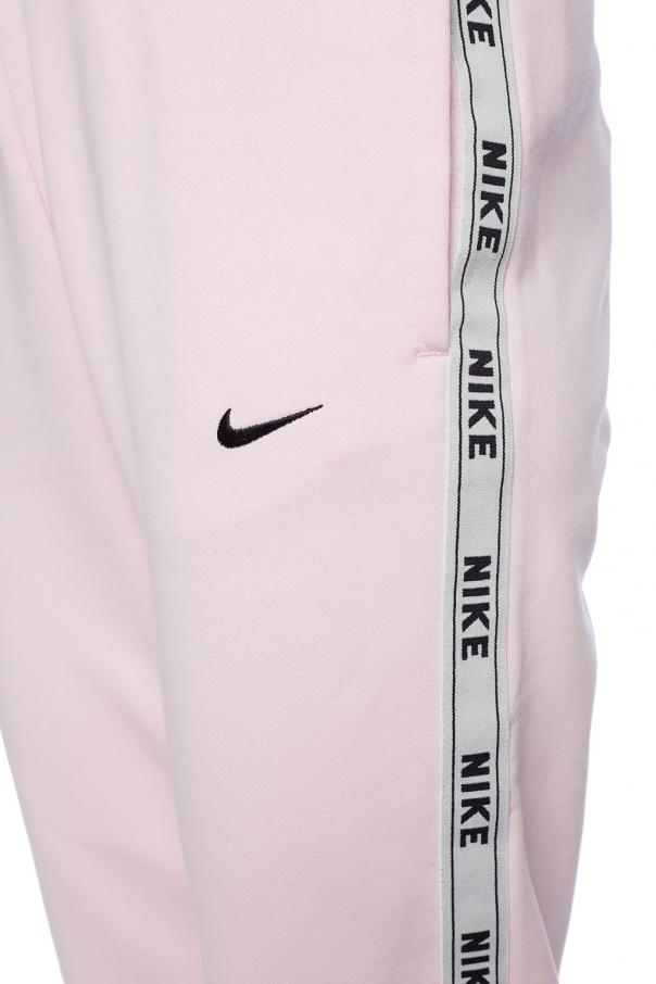 Nike joggers taped side on sale stripe